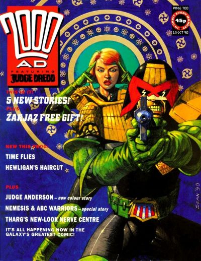 Judge Dredd pointing his gun at the reader with Judge Anderson behind him using her psi powers